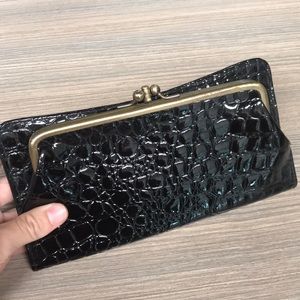 Black Wallet with gold coin pocket.